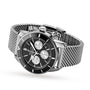 A Breitling Superocean Heritage B01 Chronograph 44 wristwatch in stainless steel with a black dial, three subdials, date window, and silver mesh strap, shown angled on a white background.