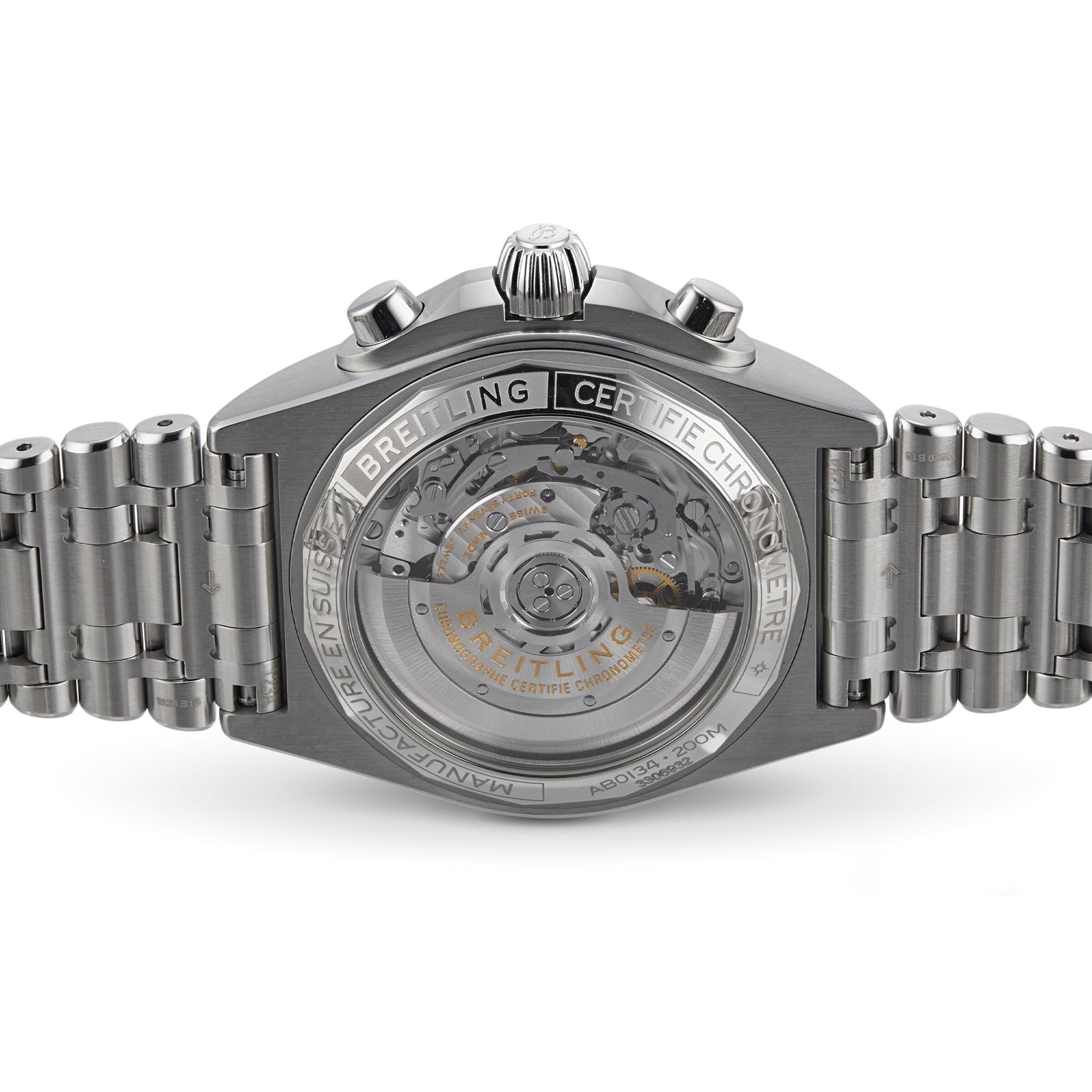 Close-up of the Breitling Chronomat B01 42’s back, highlighting its transparent stainless steel case, intricate inner movement, and detailed engraved markings on the casing and bracelet.