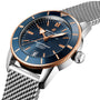 A close-up of the Breitling Superocean Heritage B20 Automatic 42 featuring a blue dial, rose gold accents, luminescent hands, and a silver mesh strap.