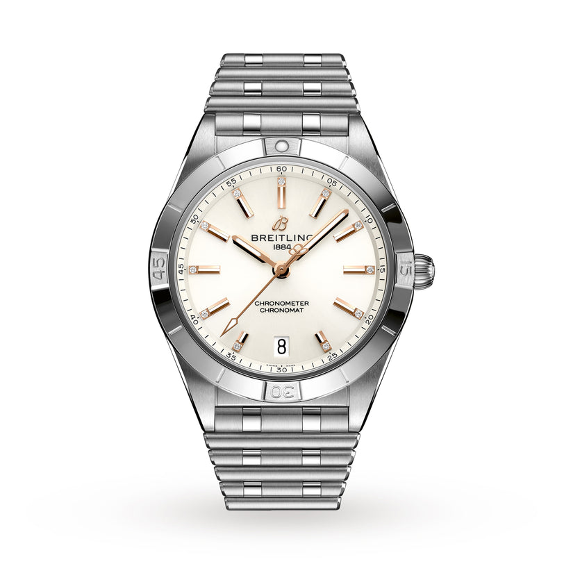 The Breitling Chronomat Automatic 36 features a stainless steel case, cream dial with gold hour markers, COSC-certified movement, date at 6 o’clock, and a signature metal Rouleaux bracelet.