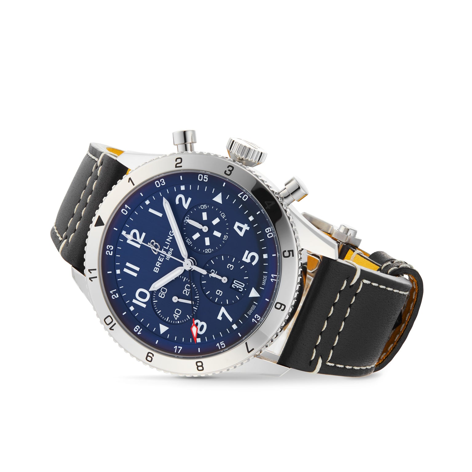 The Breitling Super AVI B04 Chronograph GMT 46 Tribute To Vought F4U features a stainless steel case, blue chronograph dial with three subdials, and a black leather strap with white stitching, displayed at an elegant angle.