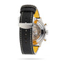 Rear view of the Breitling Super AVI B04 Chronograph GMT 46 Tribute To Vought F4U, showcasing a black leather strap with white stitching and a see-through case back that reveals the detailed inner workings.