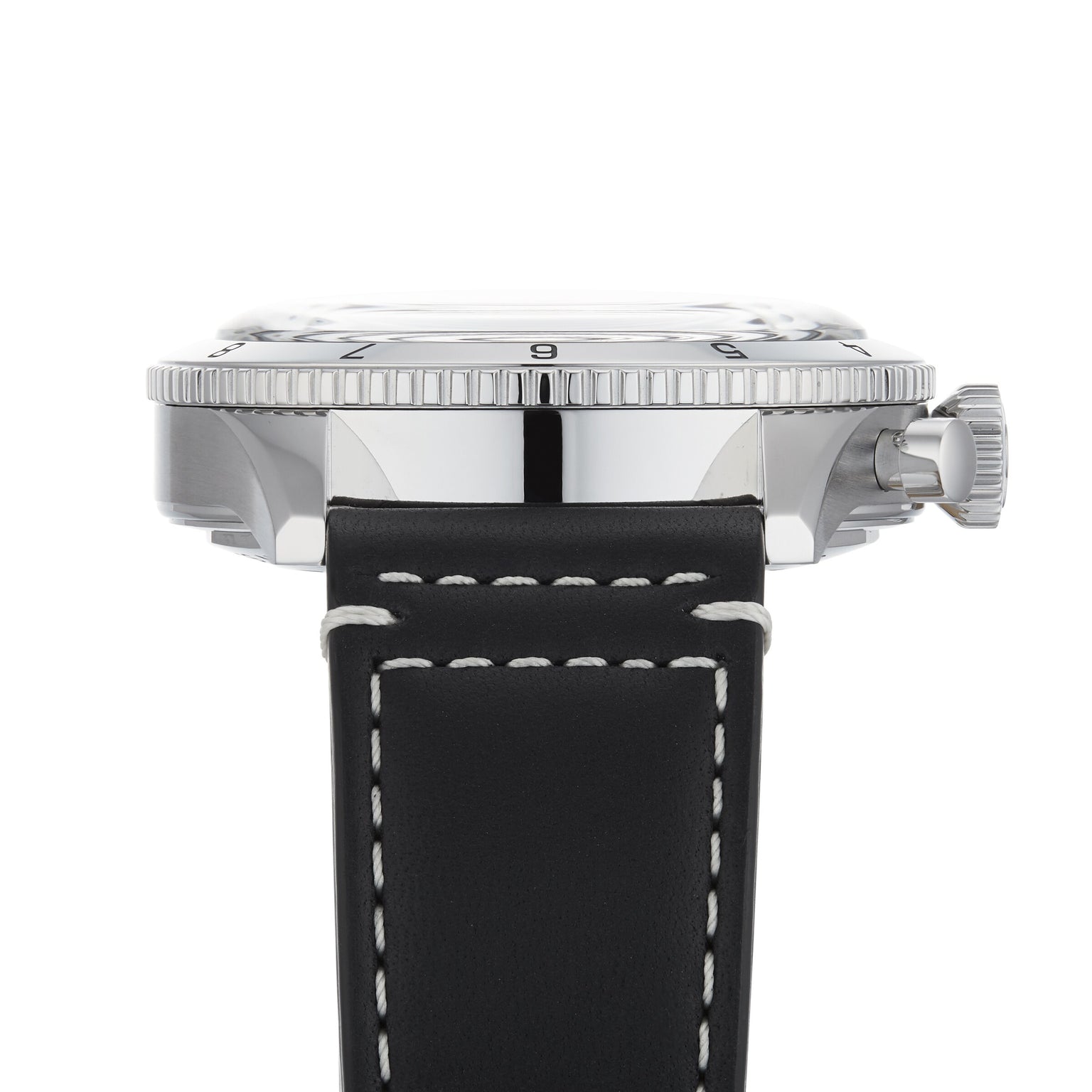 Side view of the Breitling Super AVI B04 Chronograph GMT 46 Tribute To Vought F4U, featuring a black leather strap with white stitching, silver case, ridged bezel, and crown on the right side.
