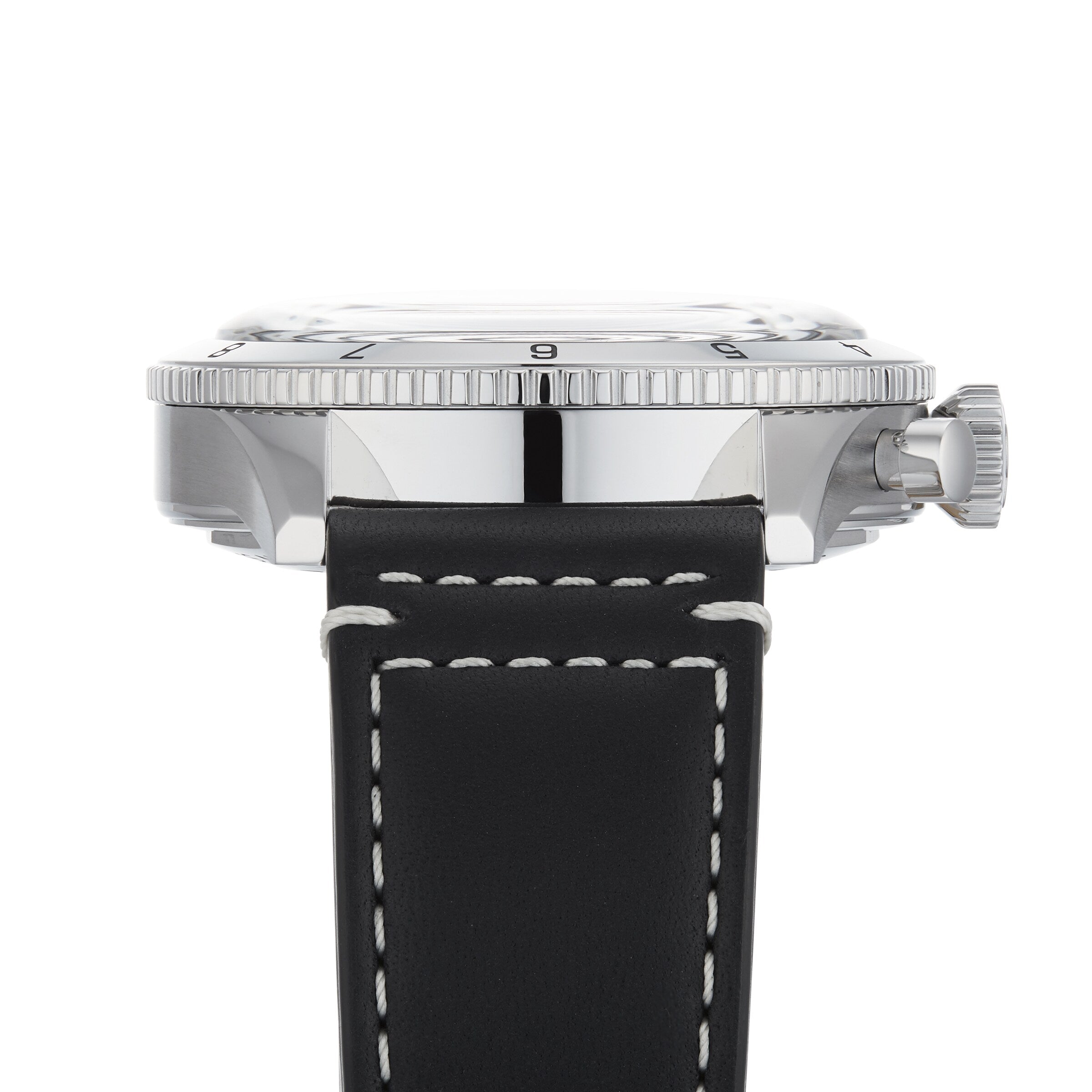 Side view of the Breitling Super AVI B04 Chronograph GMT 46 Tribute To Vought F4U, featuring a black leather strap with white stitching, silver case, ridged bezel, and crown on the right side.