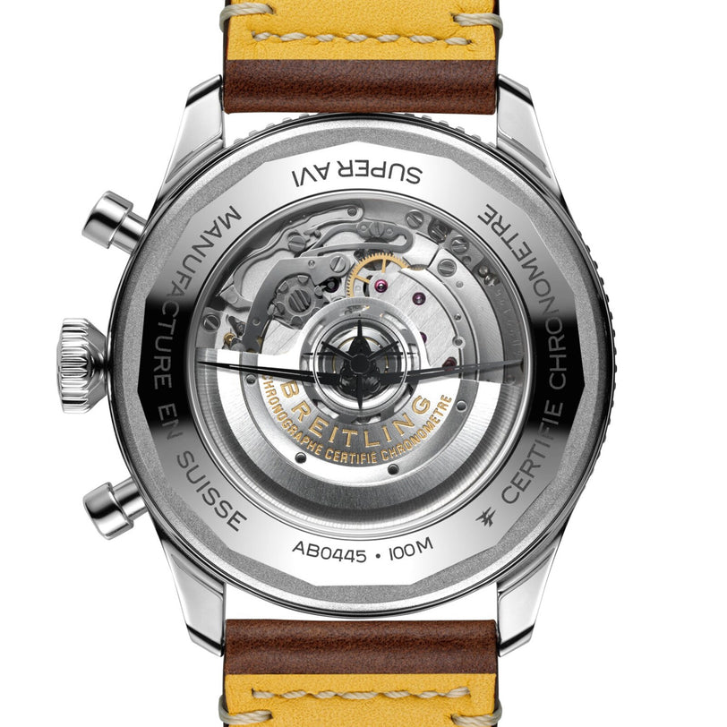 Close-up of the Breitling Super AVI B04 Chronograph GMT 46 Curtiss Warhawk, highlighting its aviation heritage with an exposed mechanical movement and a brown leather strap inspired by the Curtiss P-40 era.
