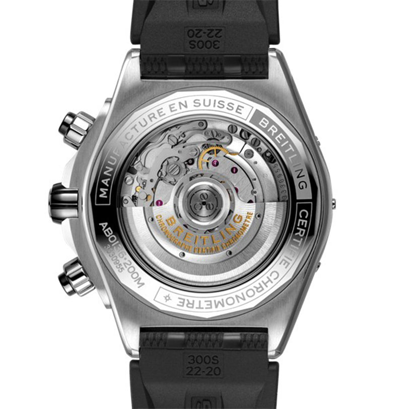 Back view of the Breitling Super Chronomat B01 44 showcases its exposed mechanical chronograph movement and intricate engravings, complemented by a black rubber strap.