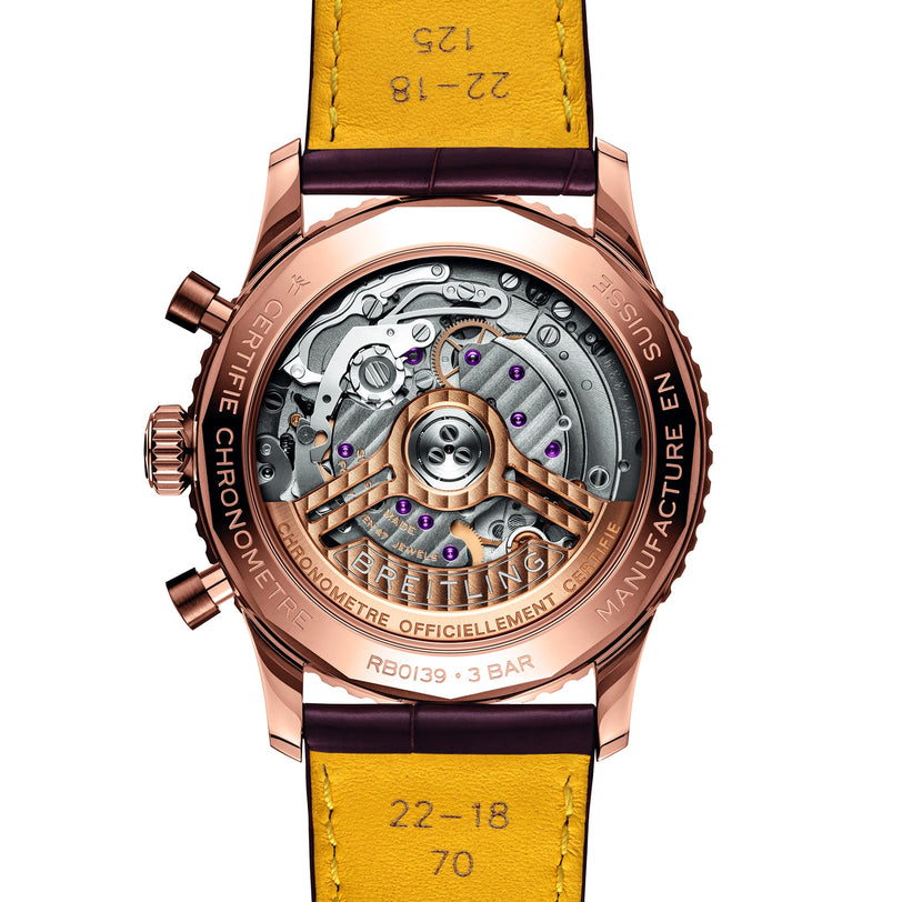 Close-up of the back of the Breitling Navitimer B01 Chronograph 41, featuring a transparent case that reveals the intricate Breitling 01 calibre movement and finely detailed engravings on both the metal components and leather strap.