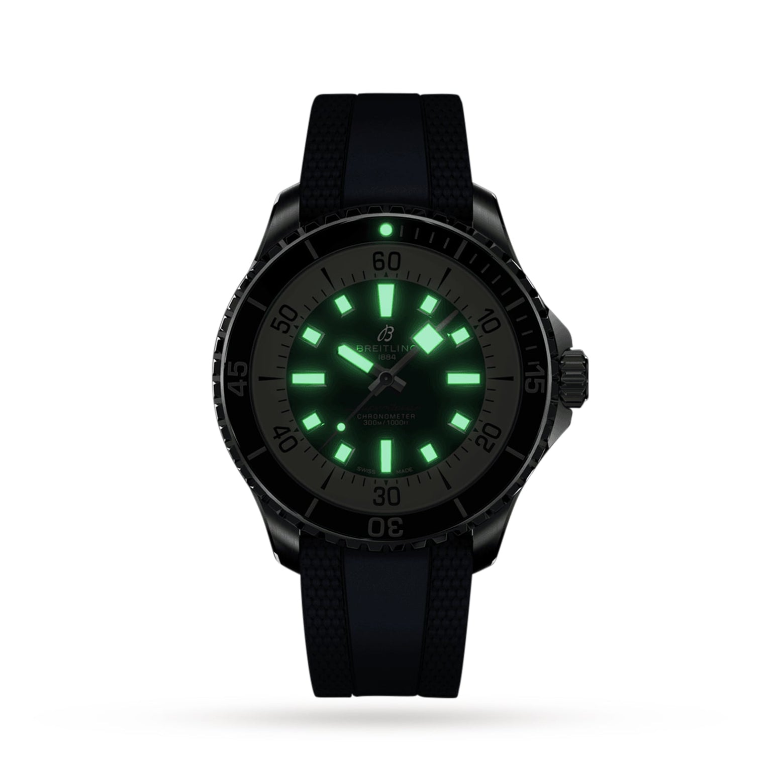 The Breitling Superocean Automatic 44 wristwatch, featuring a black band, is shown in the dark with glowing green luminescent hour markers and hands, emphasizing its automatic movement and water-resistant design.