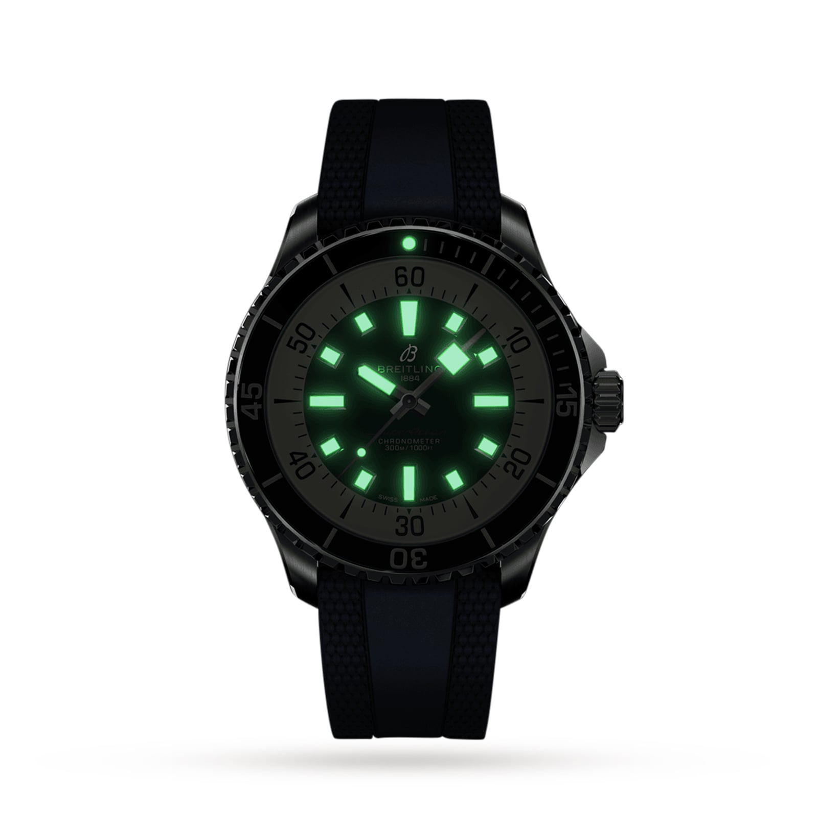 The Breitling Superocean Automatic 44 wristwatch, featuring a black band, is shown in the dark with glowing green luminescent hour markers and hands, emphasizing its automatic movement and water-resistant design.