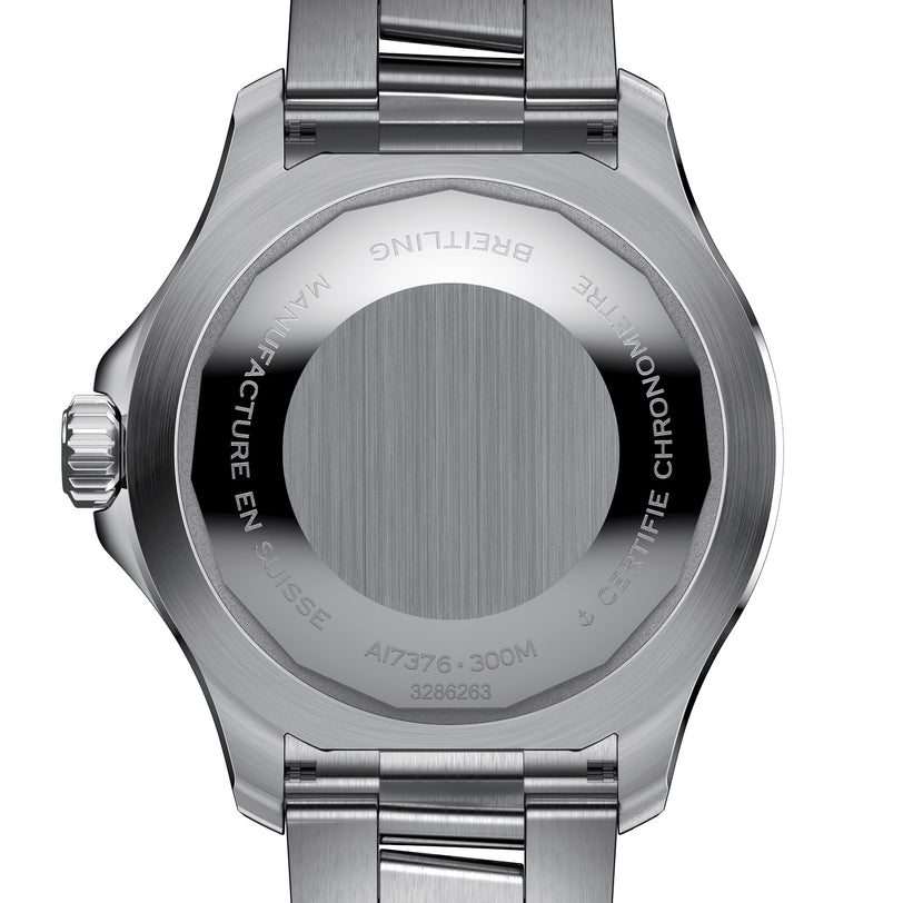 Back view of a stainless steel Breitling Superocean Automatic 44 showing engraved text around the edge, including BREITLING, MANUFACTURE EN SUISSE, CERTIFIE CHRONOMETRE, 300M water resistant, and automatic movement.