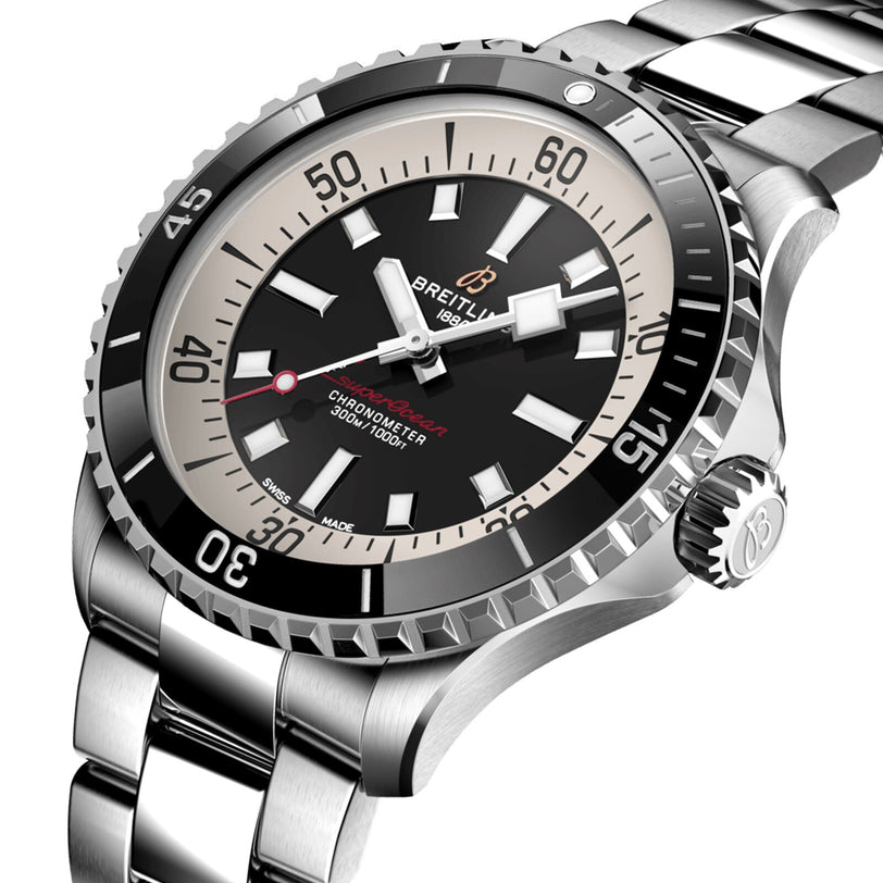Close-up of the Breitling Superocean Automatic 42, featuring a stainless steel band, black and white bezel, red accents, and 30-bar water resistance, inspired by the classic 1960s Slow Motion dive watch.