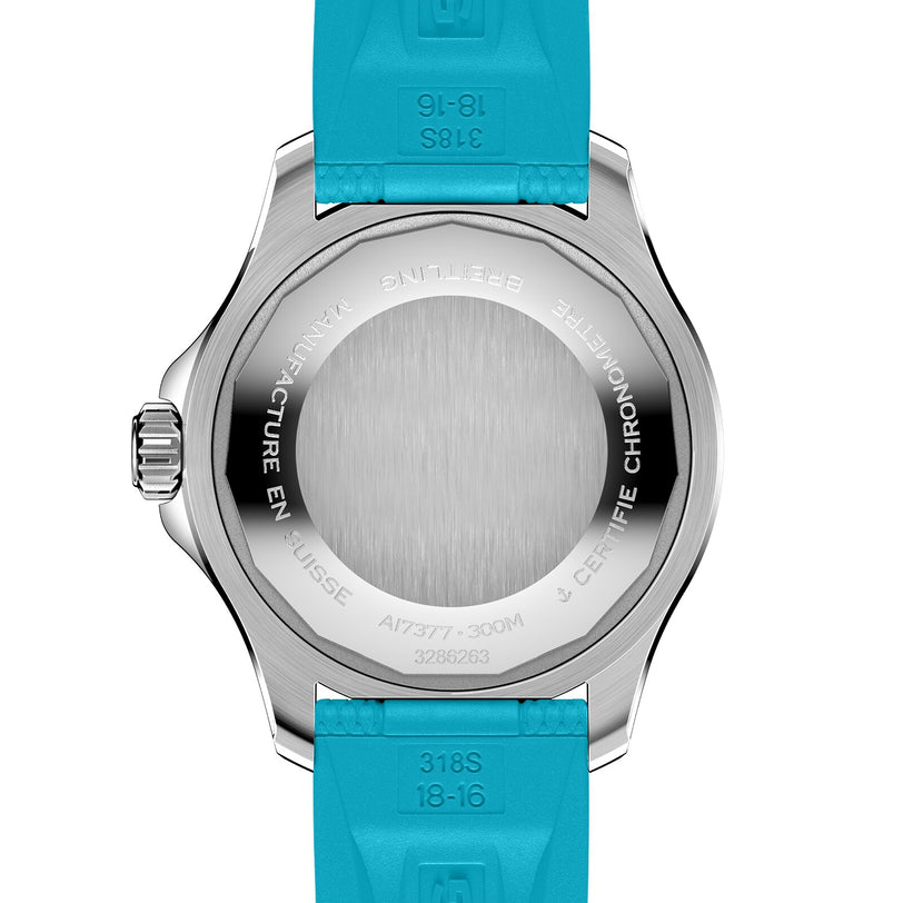 The case back of the Breitling Superocean Automatic 36 diving watch features engraved text, a brushed stainless steel center, blue rubber strap, and subtle hints of its ceramic-inlaid bezel.