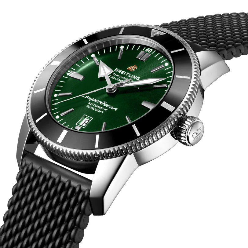 Close-up of the Breitling Superocean Heritage B20 Automatic 46, featuring a green dial, black bezel, date display, textured black strap, and COSC-certified Breitling B20 movement.