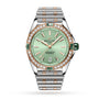 The Breitling Super Chronomat Automatic 38 features a mint green dial, diamond-set bezel, rose gold and stainless steel case, date at 6 o’clock, and a two-tone metal bracelet.