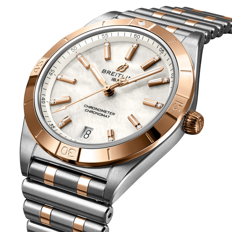 The Breitling Chronomat Automatic 36 features a silver and rose gold bezel, mother-of-pearl dial with diamond hour markers, and a silver metal link bracelet.