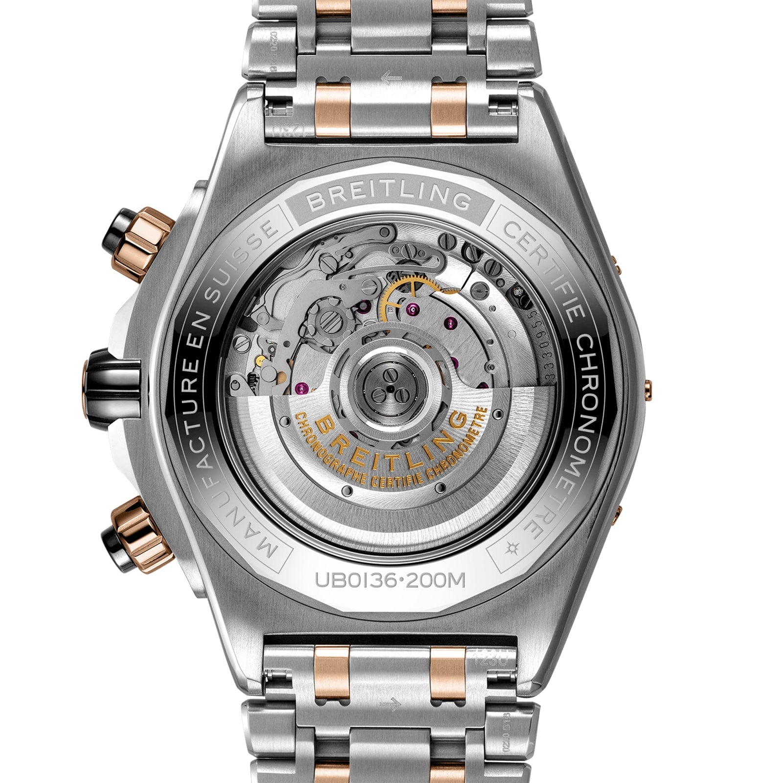 Close-up view of the Super Chronomat B01 44 case back by Breitling, featuring the exposed Breitling Manufacture 01 Movement and engraved brand markings on a two-tone metal bracelet.