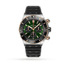 The Breitling Super Chronomat B01 44 features a green and black dial, black bezel, gold accents, three subdials powered by the Breitling 01 calibre, and a black textured strap, shown on a white background.