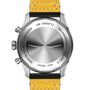 Back view of the Breitling Classic AVI Chronograph 42 Tribute To Vought F4U pilots watch with yellow leather strap, engraved with MANUFACTURE EN SUISSE, 100M, and CERTIFIE CHRONOMETRE, powered by the Breitling 23 calibre.