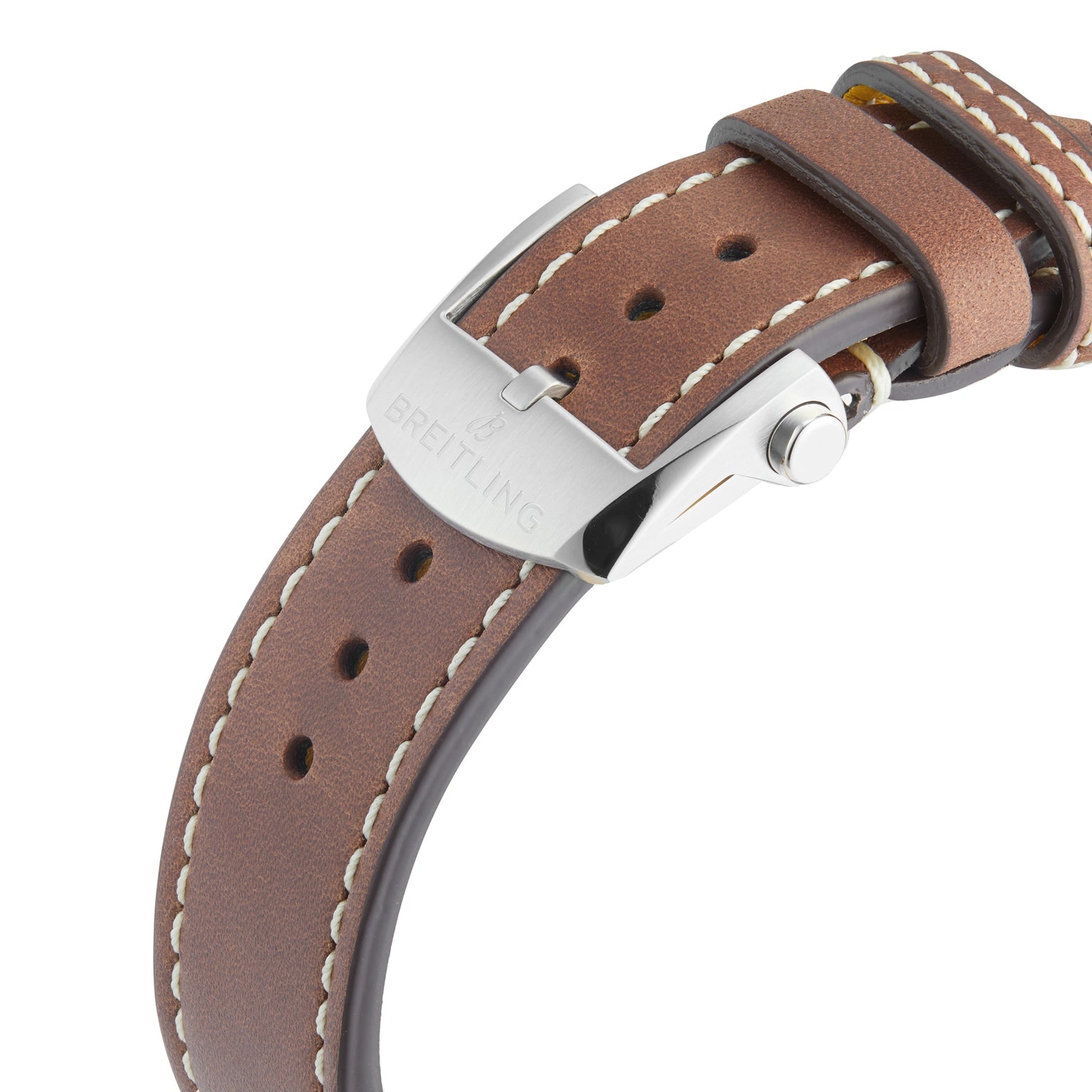 Close-up of a brown leather strap with white stitching and a silver buckle engraved with Breitling, designed for the Classic AVI Chronograph 42 Curtiss Warhawk.