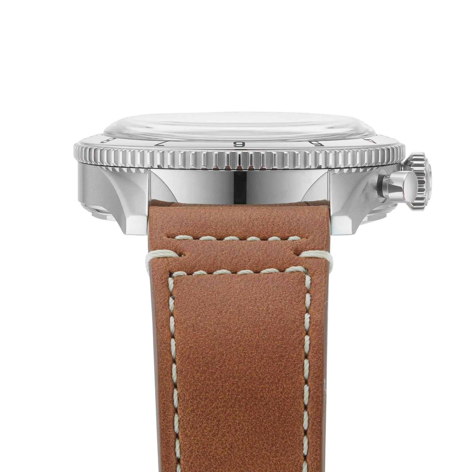 Close-up side view of the Breitling Classic AVI Chronograph 42 P-51 Mustang with a polished metal case, grooved bezel, and brown leather strap with white stitching, highlighting the precise chronograph movement.