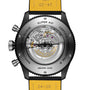 Close-up of the Breitling Super AVI B04 Chronograph GMT Mosquito Night’s caseback, revealing its mechanical movement, aviation-inspired engravings, and a yellow leather strap with measurement markings—honoring the de Havilland Mosquito.