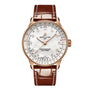 The Breitling Navitimer Automatic 36 features a brown leather strap, rose gold case, white dial with diamond hour markers, multiple chronometer functions, and is powered by the precise Breitling 17 calibre movement.