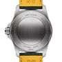 Back view of the Breitling Avenger Automatic 42 highlights its brushed stainless steel case with engraved text and a partial yellow and green military leather strap.