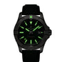 The Breitling Avenger Automatic 42 is a black wristwatch with a luminous dial, green glowing hour markers and hands, date window at 3 o’clock, and a durable military leather strap.