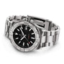 The Breitling Avenger Automatic 42 is a stainless steel wristwatch with a military-inspired black dial, date display, silver hour markers, metal link bracelet, unidirectional bezel, and Breitling 17 calibre movement.