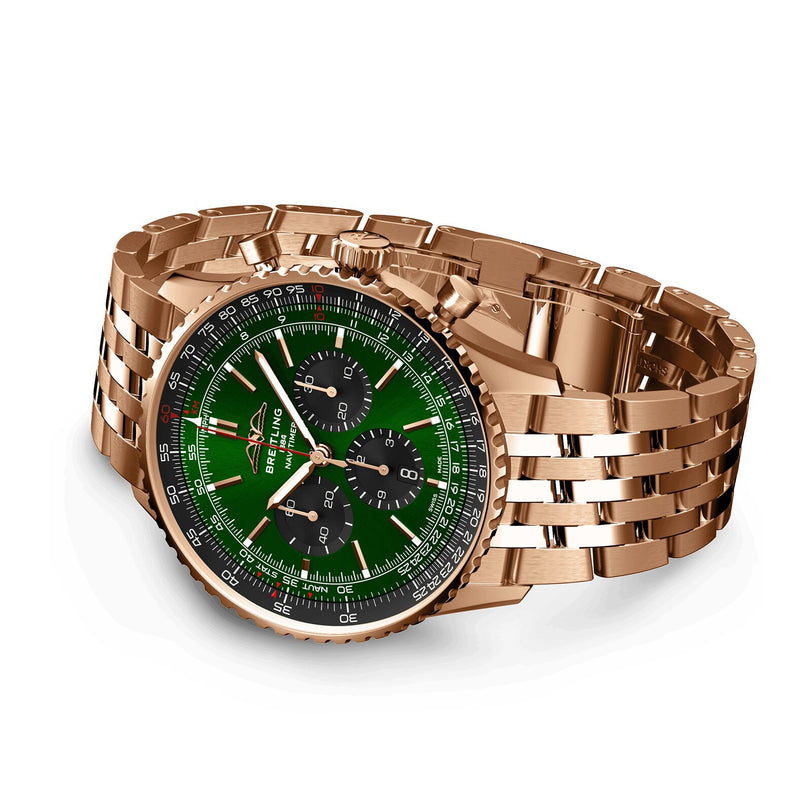 The Breitling Navitimer B01 Chronograph 46 is a gold wristwatch with a green dial, black subdials, and a metal link bracelet, shown angled on a white background—an iconic timepiece powered by the Breitling 01 movement.