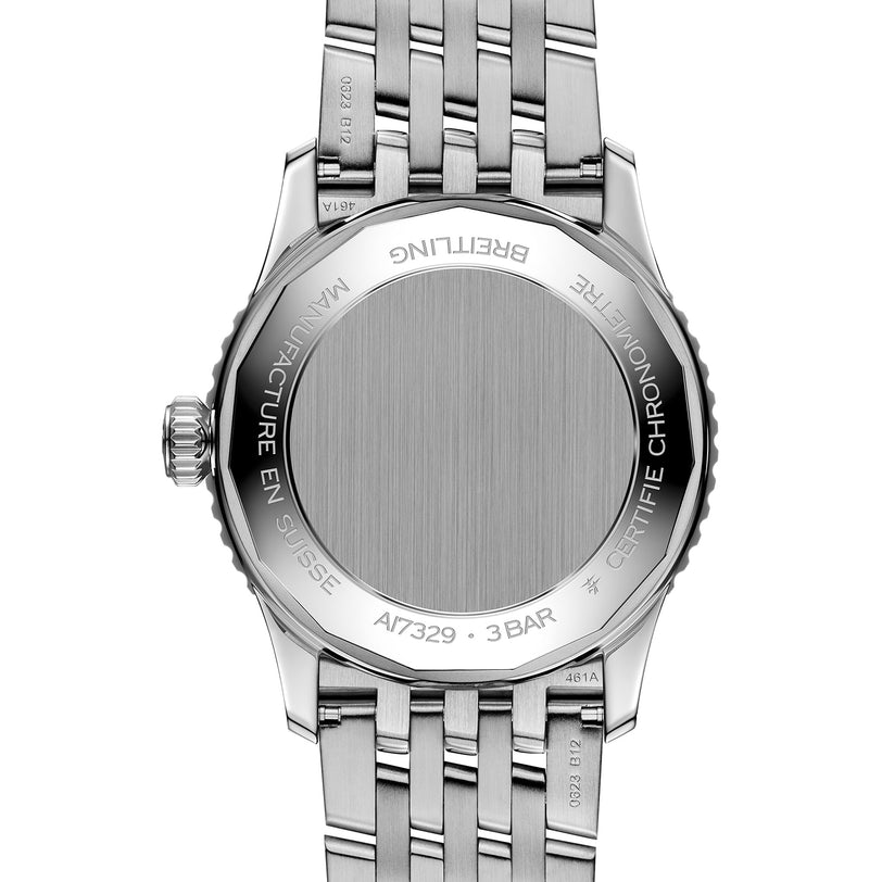 A close-up of the Breitling Navitimer Automatic 41 shows its engraved markings on the stainless steel case and the sleek metal bracelet.