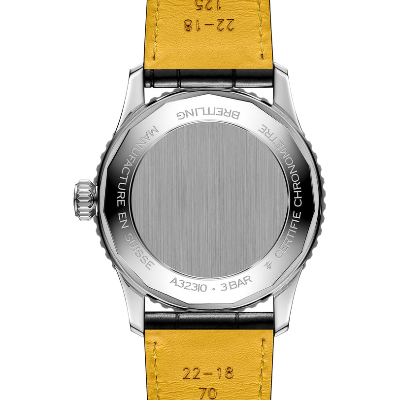 The back of a Breitling Navitimer Automatic GMT 41 wristwatch with a yellow leather strap displays engraved details including the model number and its 3 bar water resistance.