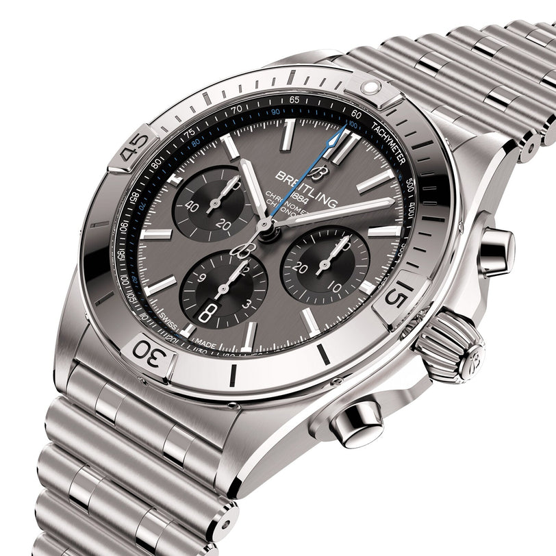 The Breitling Chronomat B01 42 is a stainless steel chronograph watch with a grey dial, three subdials, tachymeter scale, metal link bracelet, and is powered by the acclaimed Breitling 01 calibre.