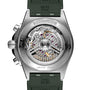 Close-up of the Breitling Chronomat B01 42’s back reveals its mechanical movement through a transparent case back, detailed engravings, and a green rubber strap.