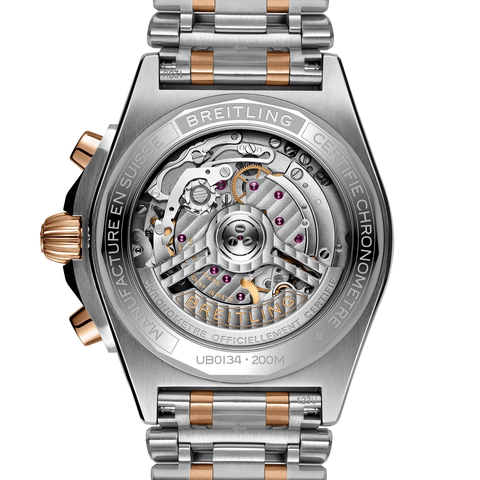 Close-up of the back of the Breitling Chronomat B01 42, revealing its exposed Breitling Manufacture 01 mechanical movement, COSC certified label, and a metal bracelet featuring silver and gold accents.