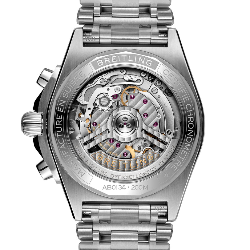 Close-up of the back of the Breitling Chronomat B01 42, showcasing its transparent case that reveals the Breitling 01 calibre mechanical movement and internal components, finished with a signature Rouleaux bracelet.