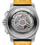 Close-up of the back of the Breitling Super Avenger B01 Chronograph 46, highlighting its exposed automatic movement with visible gears, engraved details, and a bold yellow and black aviation-style strap.