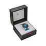 The Oris Aquis Pro 4000M, featuring a blue and silver design, is pictured in an open black Oris watch box with a white interior.