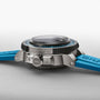 Side view of the Oris Aquis Pro 4000M, a dive watch with a blue strap, metal case, crown, Calibre 400 movement, and water resistance tested to 4000 metres.