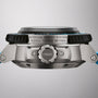 Side view of the Oris Aquis Pro 4000M showing its metal case, branded crown, ROTATION SAFETY SYSTEM TESTED TO 4000 METRES text, and blue strap. Powered by the Calibre 400 movement.