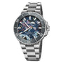 The Oris Aquis Date Upcycle is a stainless steel diving watch featuring a multicolored dial, rotating bezel, date display at 6 o’clock, and a metal bracelet.