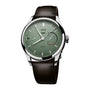 Oris watch with green dial and black leather strap on a white background