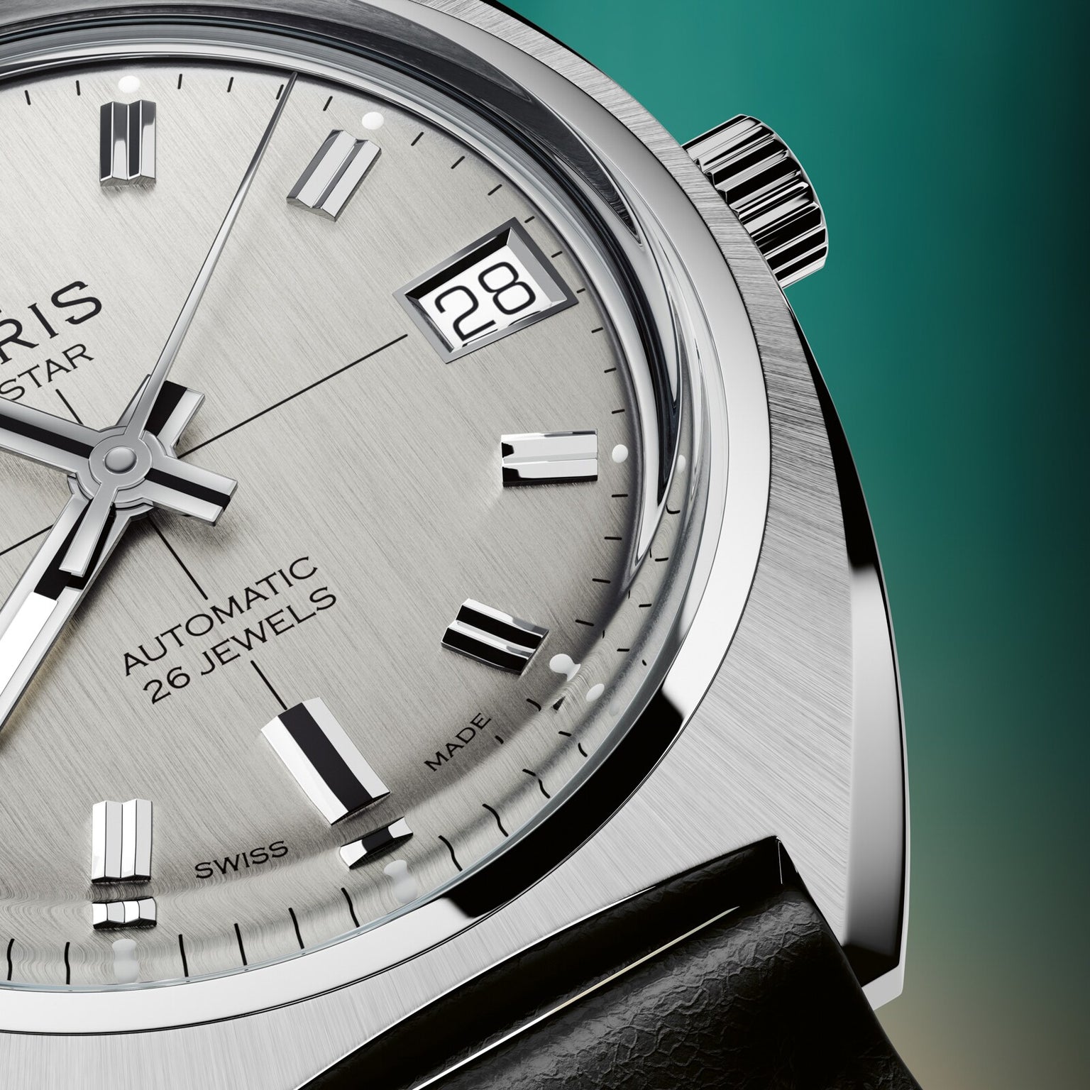 Silver-toned automatic watch with square date window, black hour markers, and textured dial against teal background.