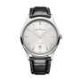 The Jaeger-LeCoultre Master Ultra Thin Date features a silver case, white dial, slim silver hour markers, date at 6 o’clock, and a black leather strap. This watch boasts a classic, minimalist ultra-thin design.