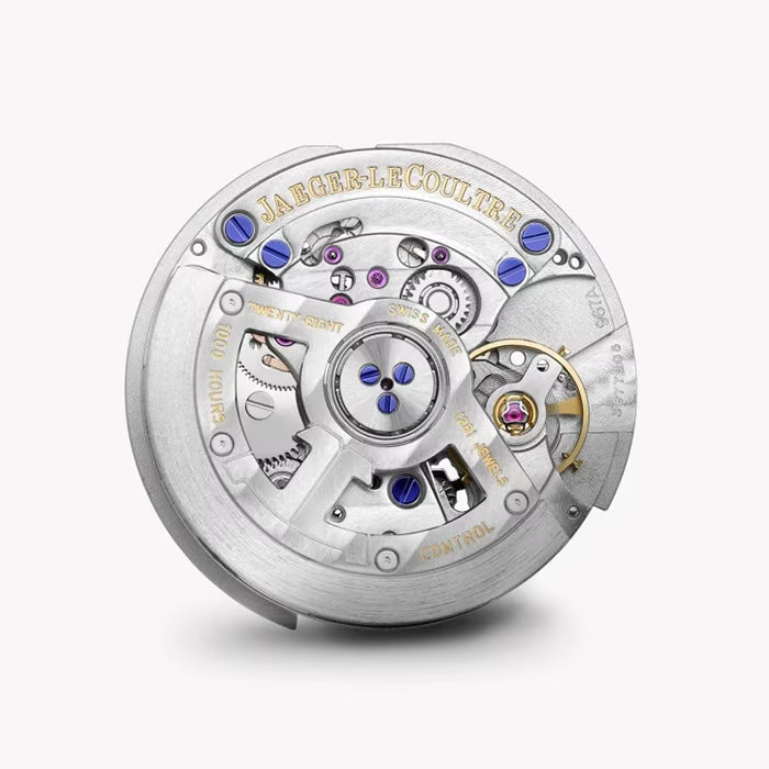 Close-up of the Jaeger-LeCoultre Rendez-Vous Night & Day mechanical movement, highlighting silver gears, blue and gold accents, and detailed engravings from the iconic collection against a white background.