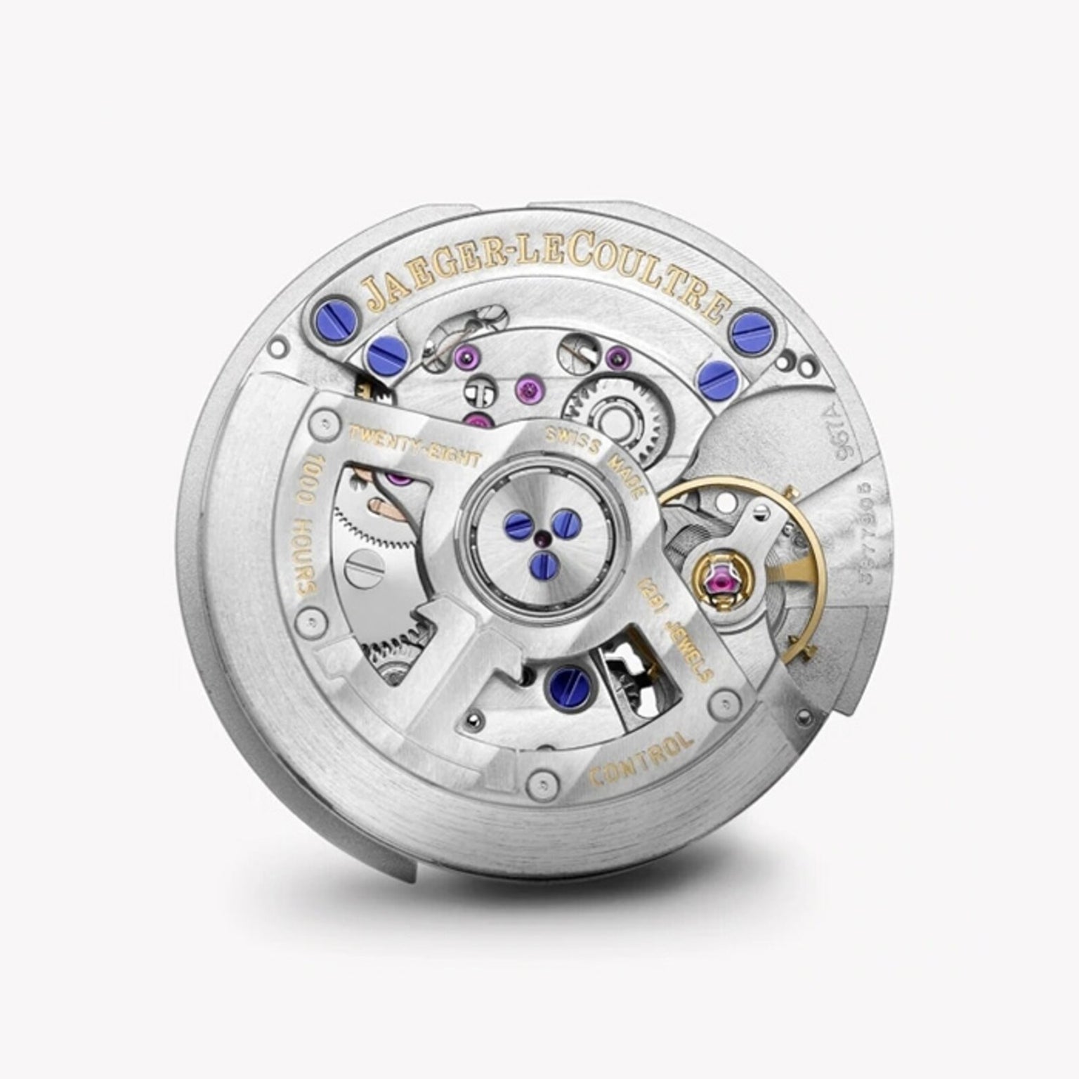 A close-up of the Swiss-made Jaeger-LeCoultre Rendez-Vous Night & Day watch movement, highlighting detailed metal gears, jewel bearings, screws, and engraved branding on the silver components.