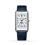The Jaeger-LeCoultre Reverso Tribute Duoface Calendar is a luxury watch with a rectangular silver case, white dial, blue markers and hands, a moon phase at 6 o’clock, and a dark blue leather strap.