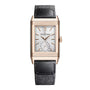 The Jaeger-LeCoultre Reverso Tribute Small Seconds is a rectangular luxury watch with a reversible gold case, silver dial, black leather strap, small seconds subdial at 6 o’clock, gold hour markers, and the Jaeger-LeCoultre logo.