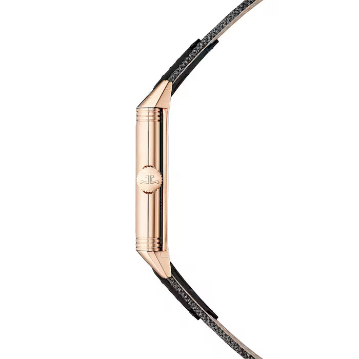 Side view of the Jaeger-LeCoultre Reverso Tribute Small Seconds, featuring a rose gold rectangular case, decorative crown, and black leather strap on a white background.