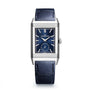 The Jaeger-LeCoultre Reverso Tribute Duoface Small Seconds is a rectangular stainless steel watch with a blue dial, leather strap, Art Deco design, logo display, and a small seconds subdial at 6 o’clock.
